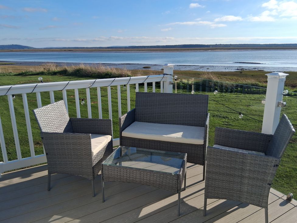 An outdoor seating area with a couch and armchairs at Willerby Malton 2023 in Kidwelly