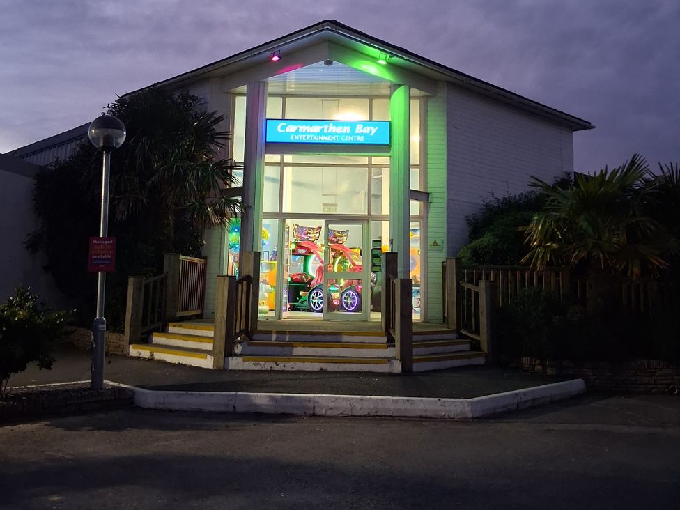 A building entrance with a sign at Carmarthen Bay Entertainment Centre in Kidwelly