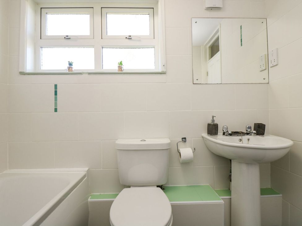 A bathroom with a sink and bathtub at Valley Lodge 61 Callington