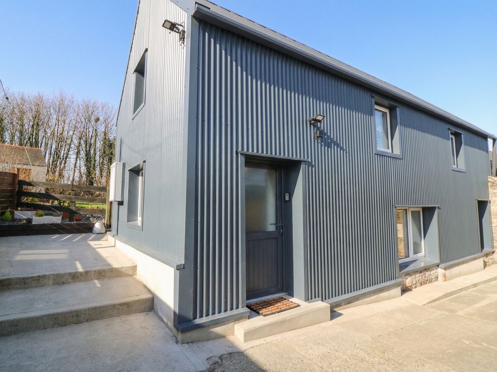 An exterior view of a modern house with a door and windows at The Loft in Glenmore, County Kilkenny