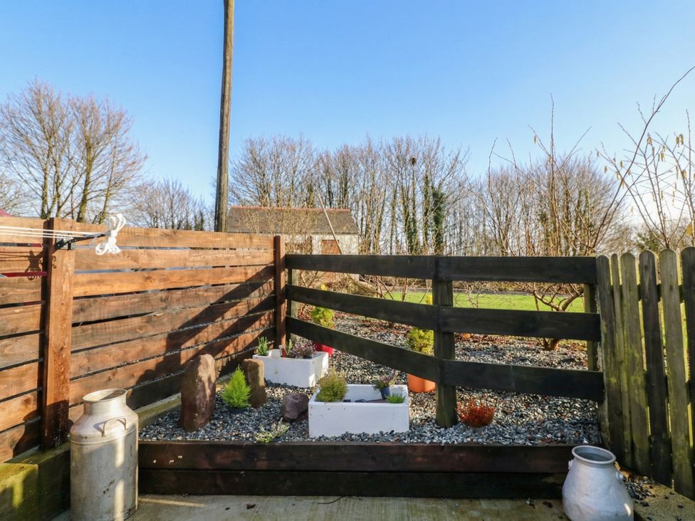 A garden area with plants and a wooden fence at The Loft in Glenmore, County Kilkenny