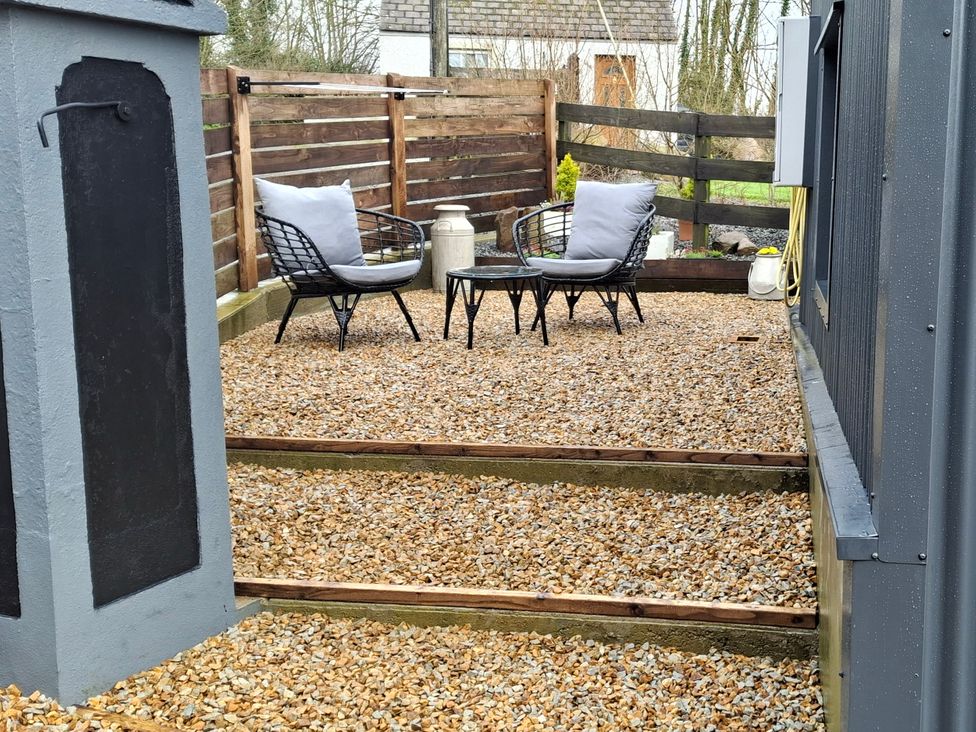 An outdoor seating area with chairs and a table at The Loft in Glenmore, County Kilkenny