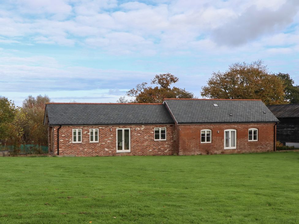 A house with grass and trees around at Hilldown Cott Crediton