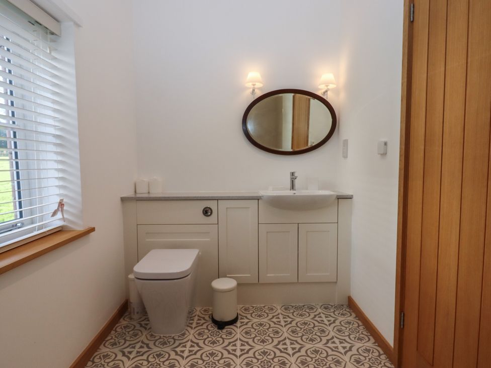 A bathroom with a sink and toilet at Hilldown Cott near Bow