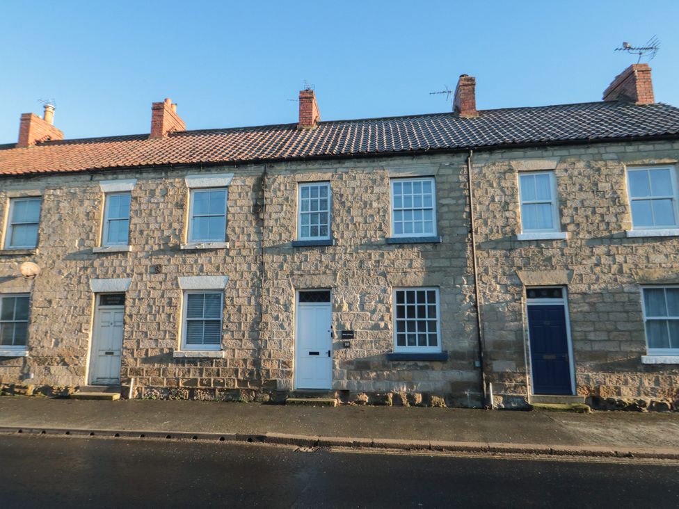 An exterior view of a stone terraced house at Daisy cottage Pickering