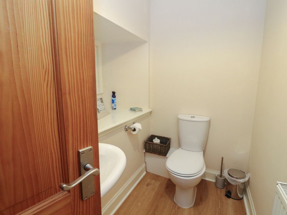 A bathroom with a toilet and sink at The Cottage in Perth