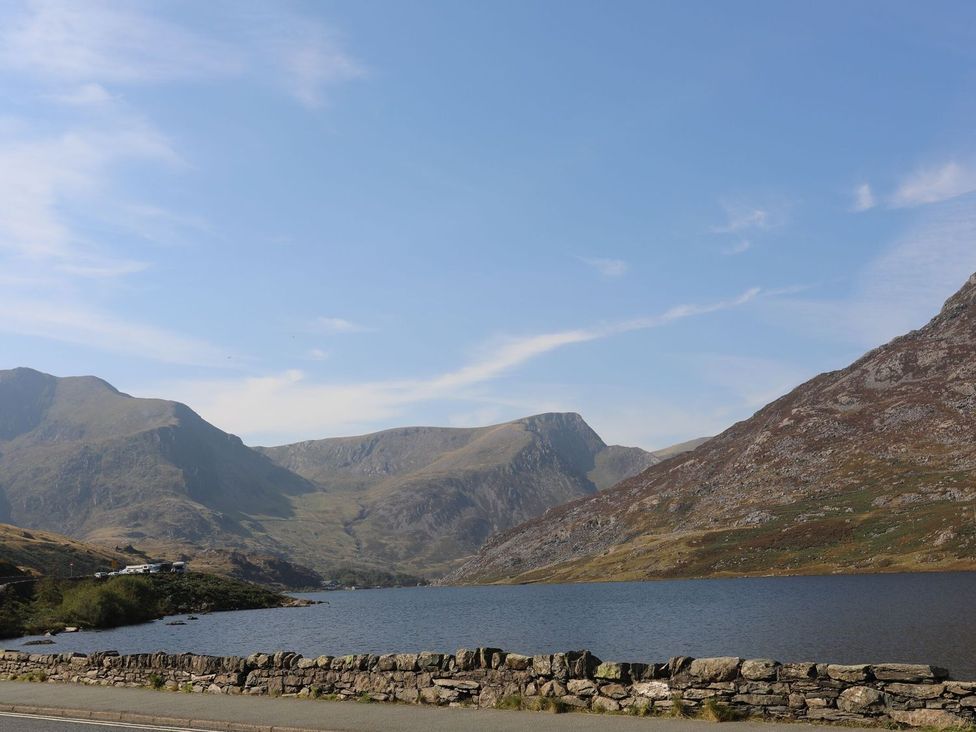 A landscape view of mountains and a lake at Noddfa Penmachno