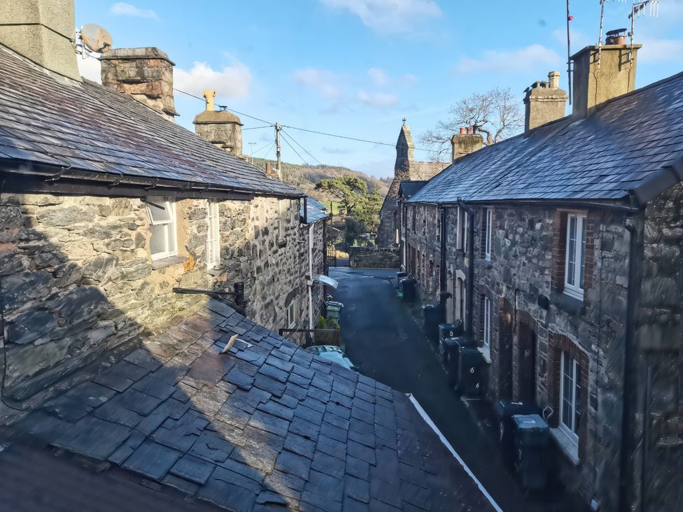 A view of stone houses and a road at Noddfa in Penmachno