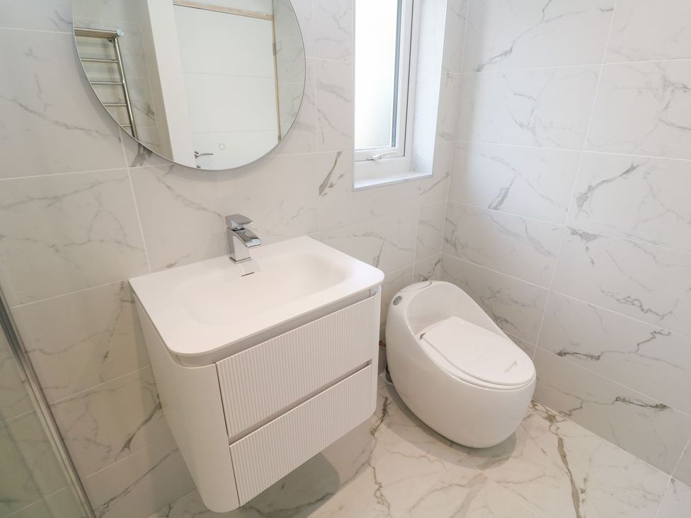 A bathroom with a sink and toilet at Shearwater in Praa Sands