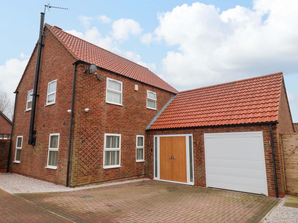 A house with a garage and driveway at 23 Main Street in 