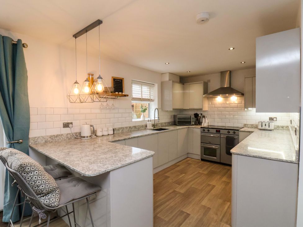 A kitchen with modern appliances and a countertop at 23 Main Street