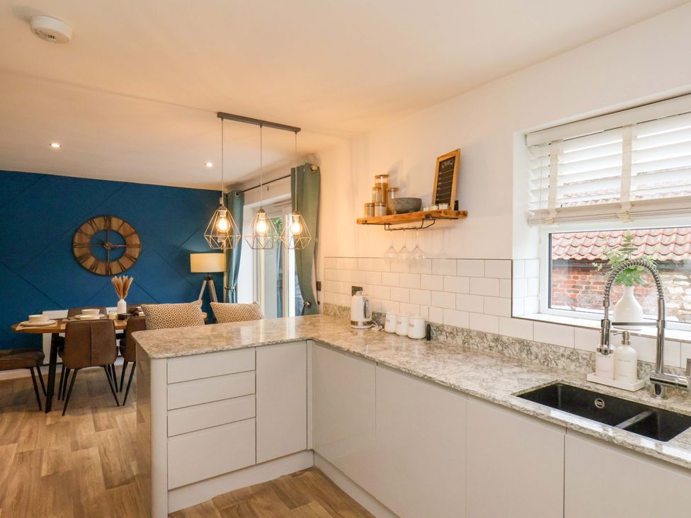 A kitchen with countertop and dining area at 23 Main Street 