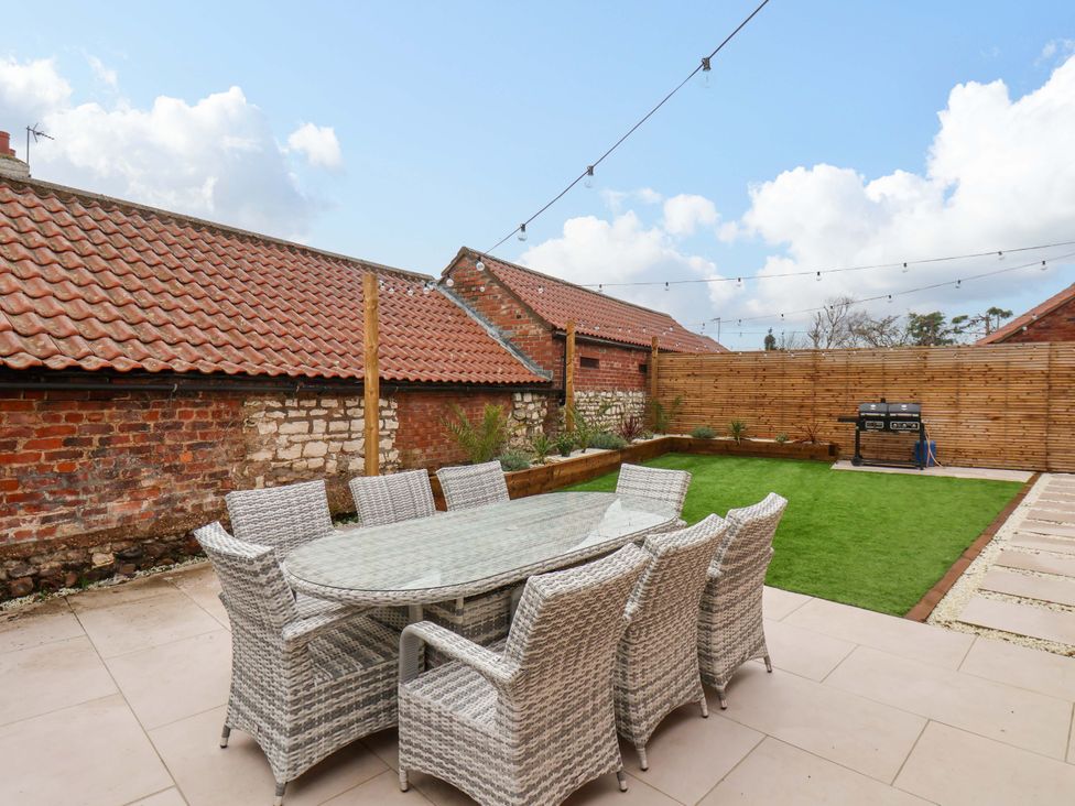 An outdoor dining area with table and chairs at 23 Main Street 