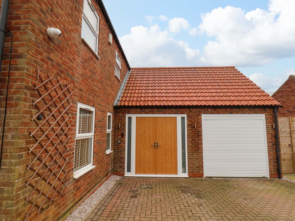 An exterior view of a house with a front door and garage at 23 Main Street 