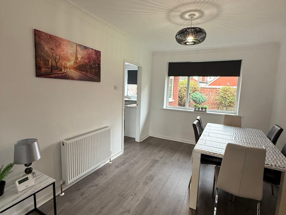A dining room with a table and chairs at Beach Side Bungalow