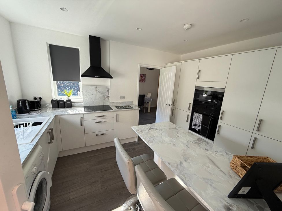 A kitchen with a sink and stove at Beach Side Bungalow in 