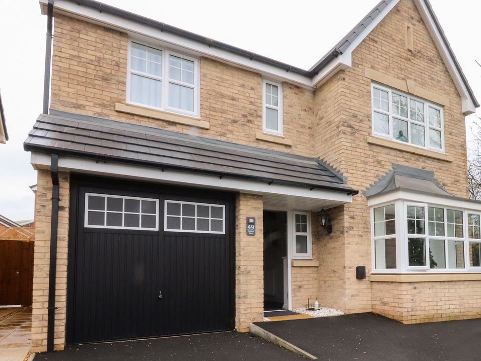 A house with a garage and pathway at 49 Mellings Place