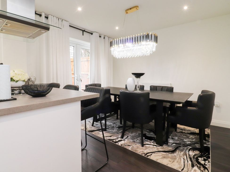 A dining room with a table and chairs at 49 Mellings Place