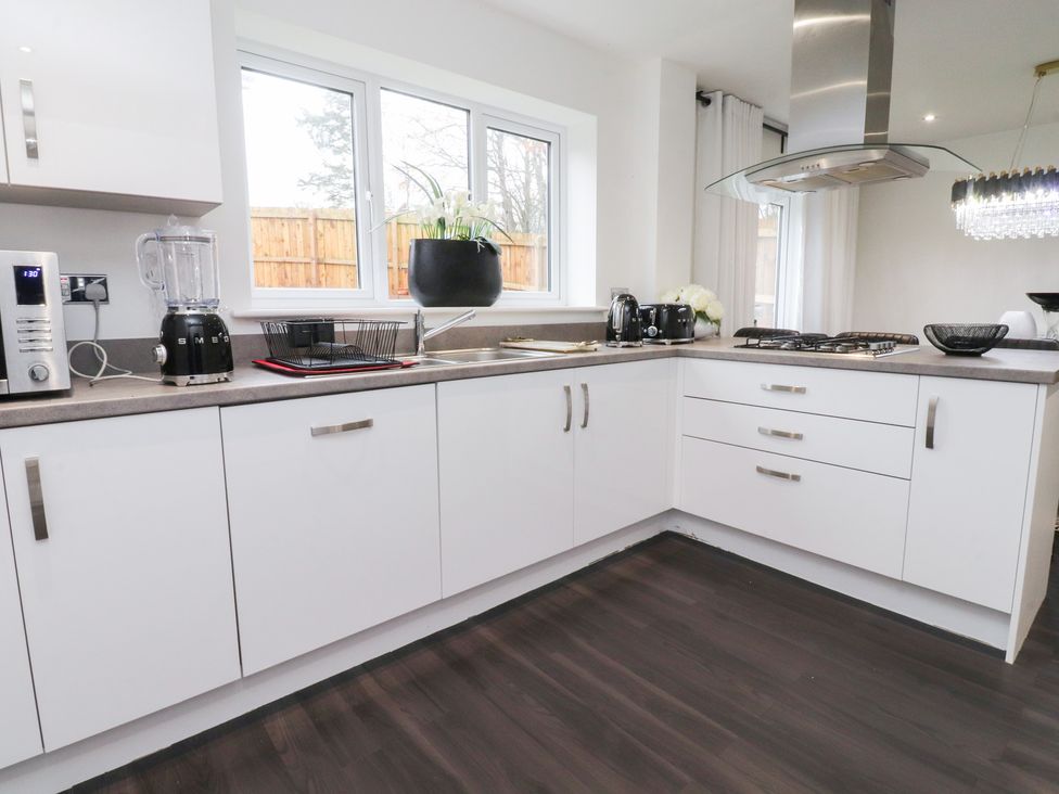 A kitchen with appliances and sink at 49 Mellings Place