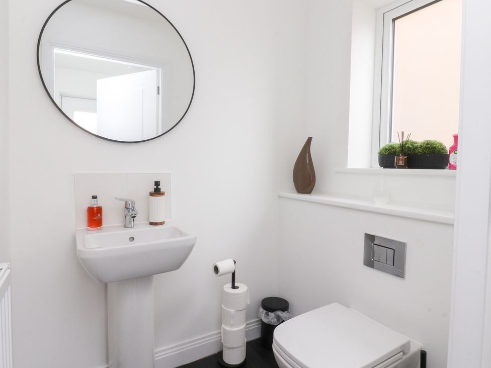 A bathroom featuring a sink and toilet at 49 Mellings Place