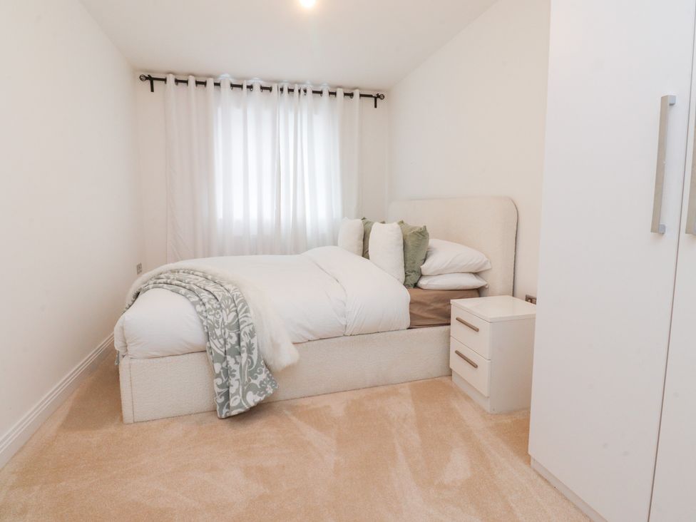 A bedroom with a bed and nightstand at 49 Mellings Place