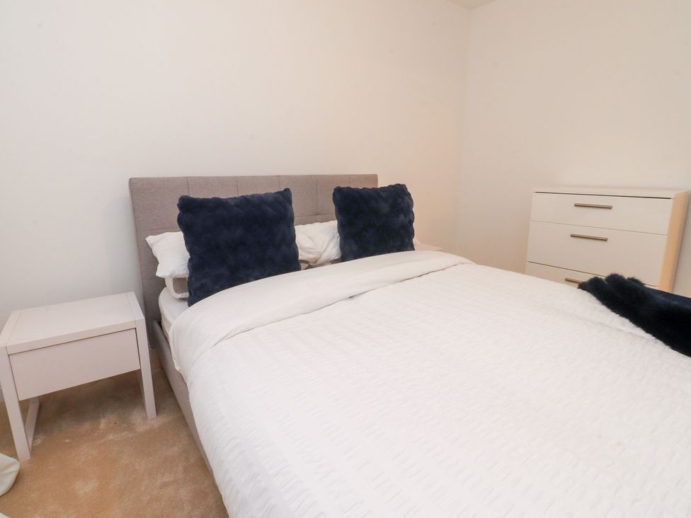 A bedroom with a bed and nightstand at 49 Mellings Place