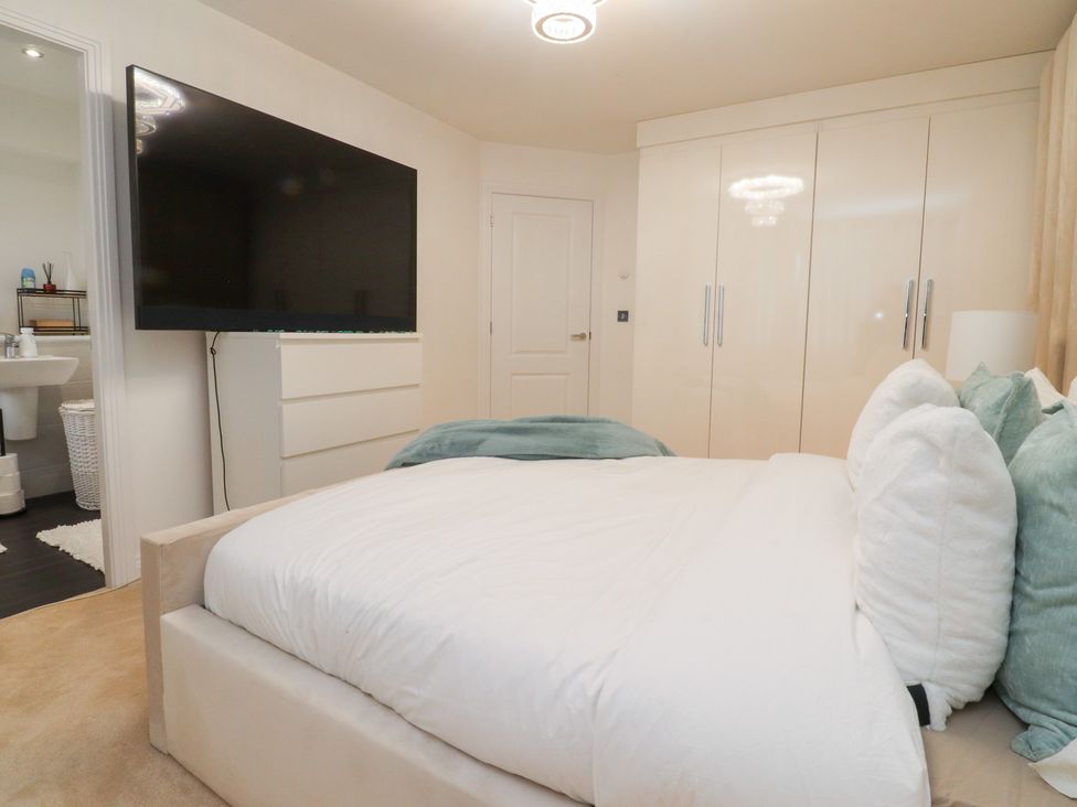 A bedroom with a bed and television at 49 Mellings Place 