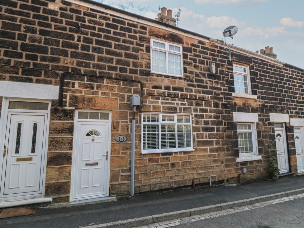 A stone wall with doors and windows at 9 Cliffe Street Saltburn-by-the-Sea