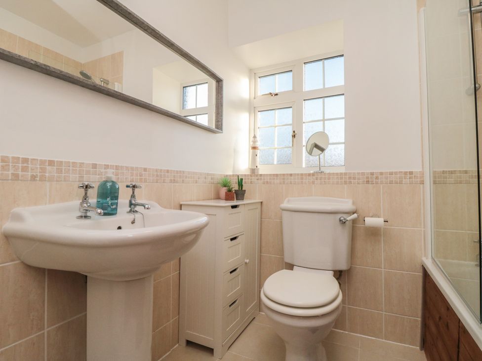 A bathroom with sink and toilet at Cliffe Cottage, Brotton, North Yorkshire