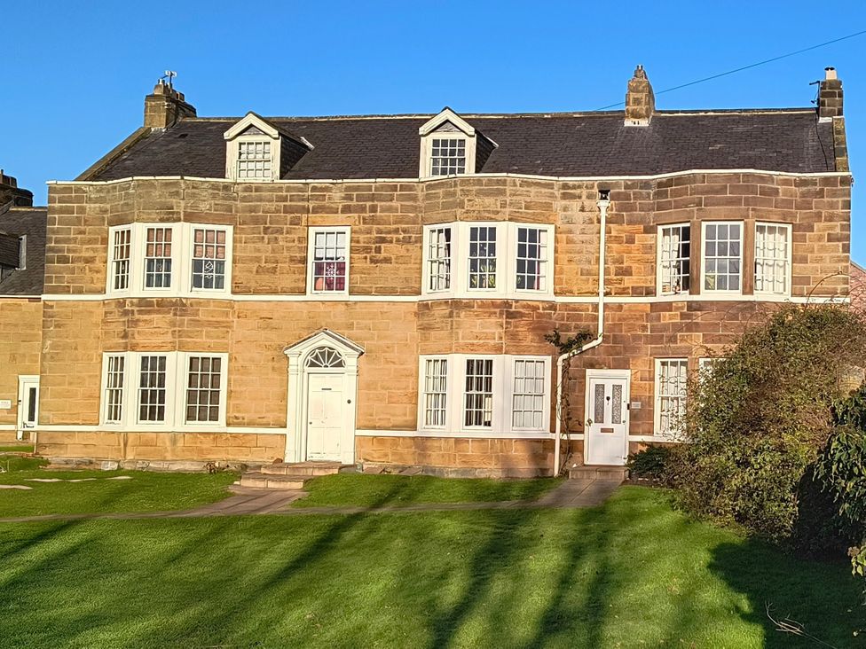 A house with multiple windows and a front door at Cliffe Cottage, Brotton, North Yorkshire