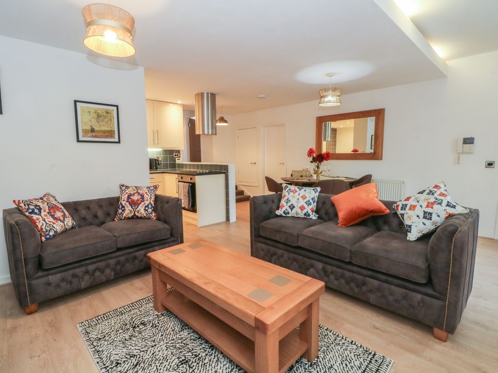 A living room with sofas and a coffee table at 32A Bank Street, Rossendale