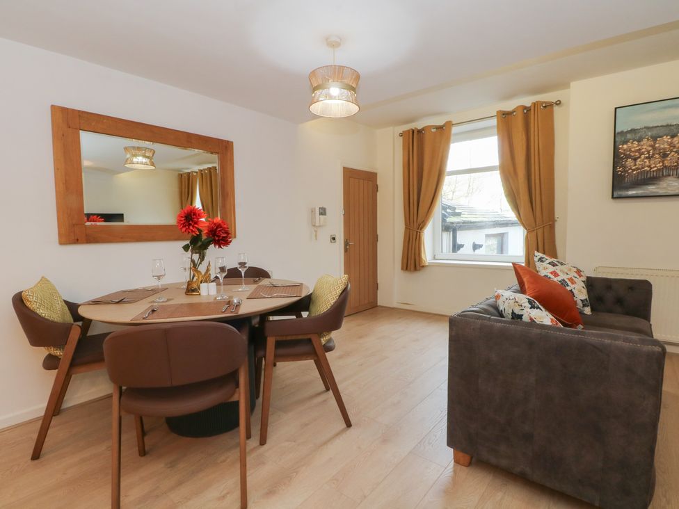 A dining area with a table and chairs at 32A Bank Street Rossendale