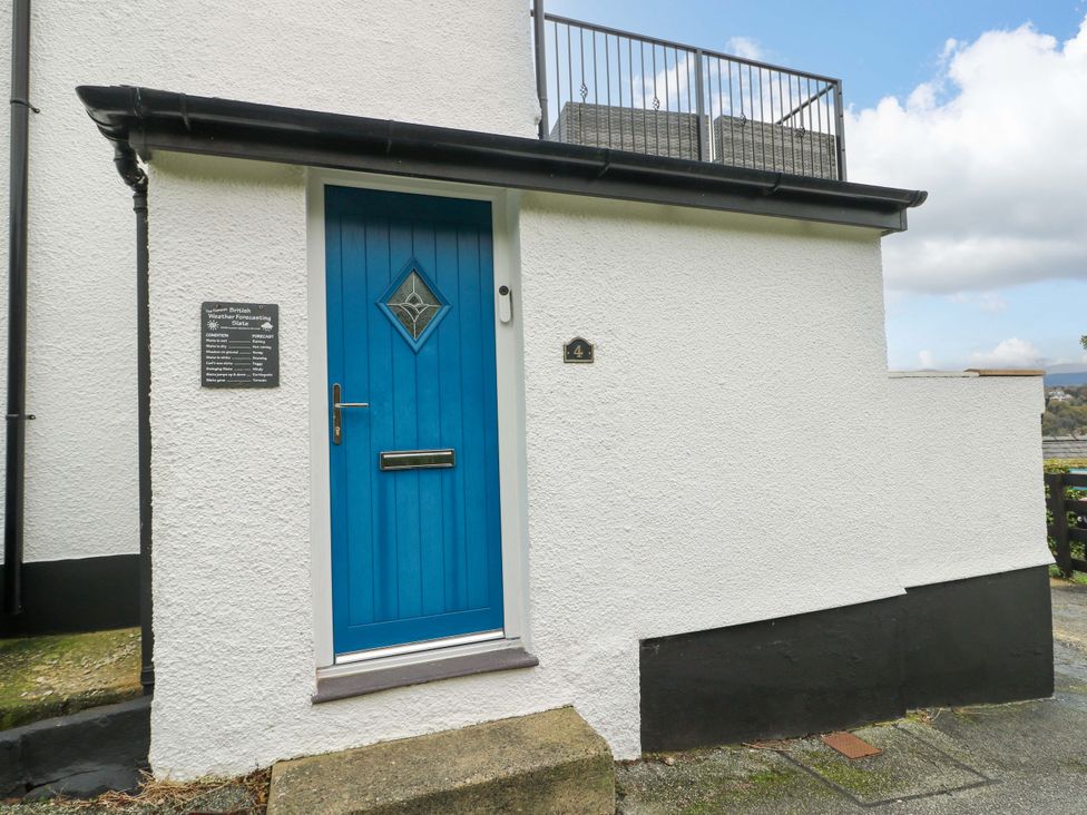 An entrance door with a blue color at 4 Brynteg Terrace in Menai Bridge