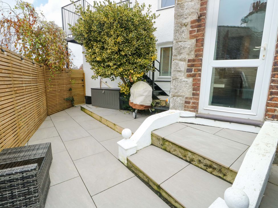A garden with steps and a storage box at 4 Brynteg Terrace Menai Bridge