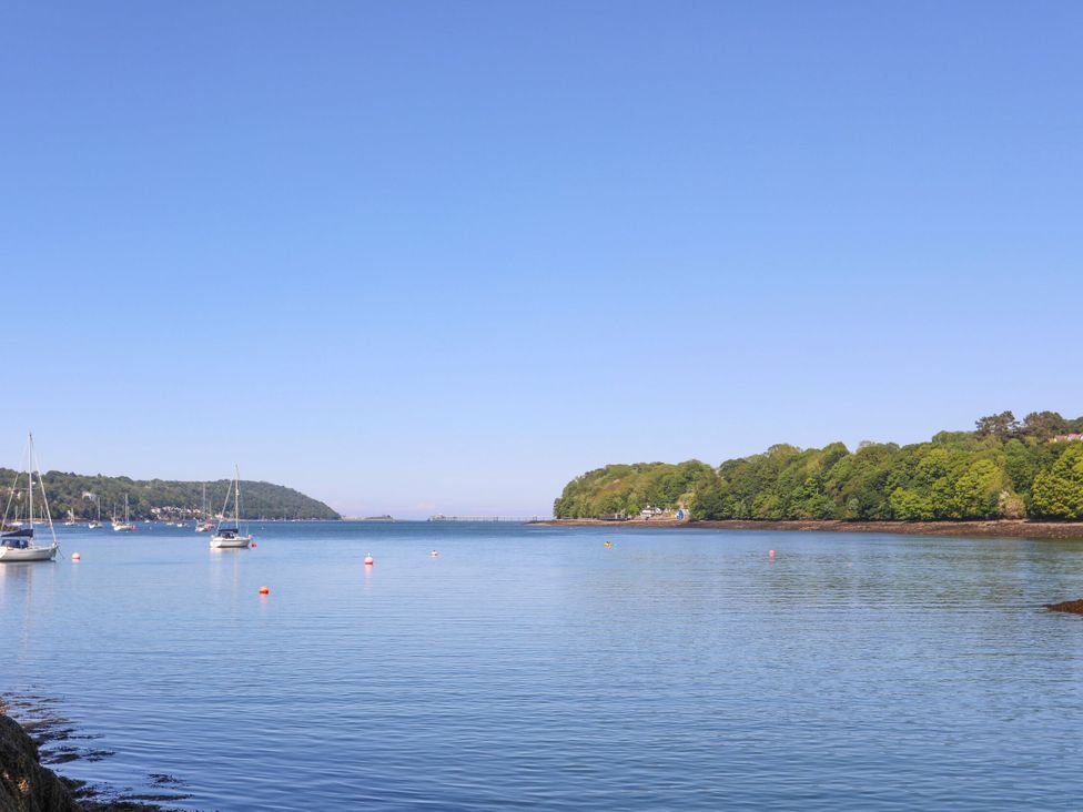 A view of boats on water with trees in the background at 4 Brynteg Terrace Menai Bridge