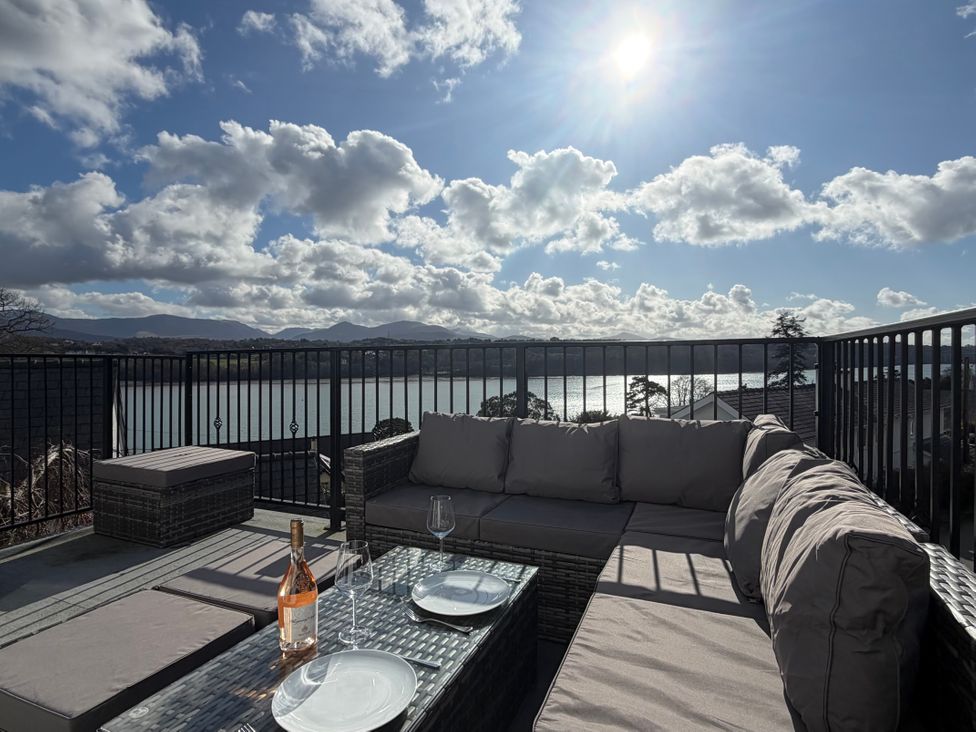 An outdoor terrace with seating and a view at 4 Brynteg Terrace in Menai Bridge