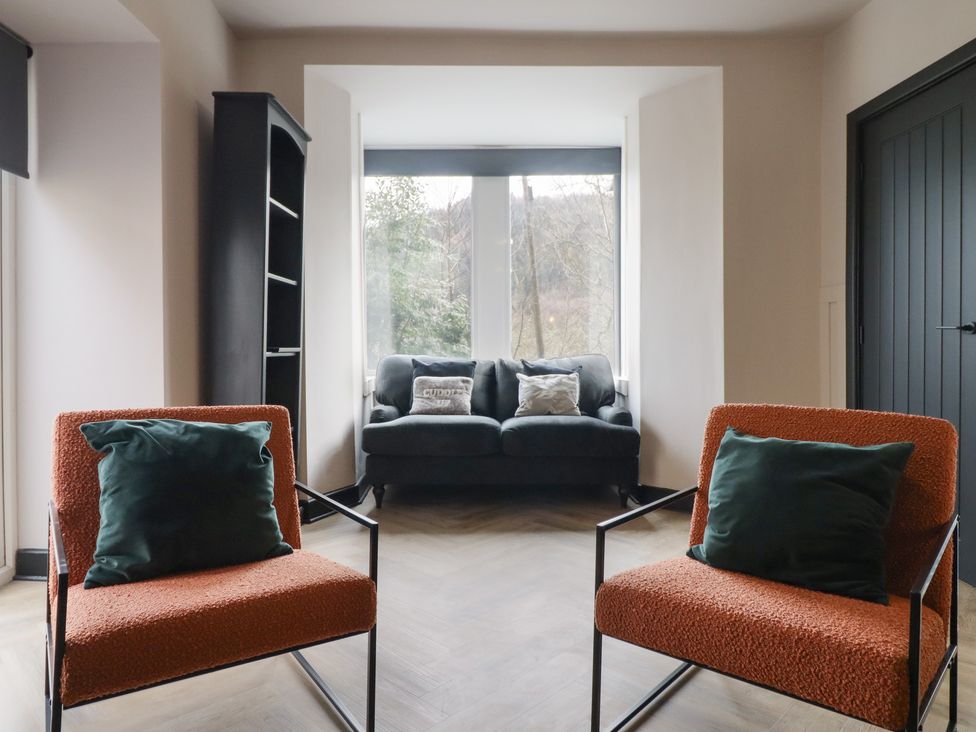 A living room with two chairs and a sofa at Green Bank Betws-Y-Coed