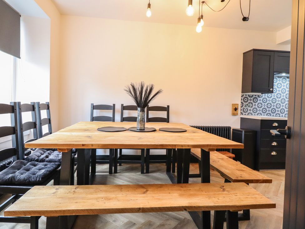 A dining room with a table and chairs at Green Bank in Betws-Y-Coed