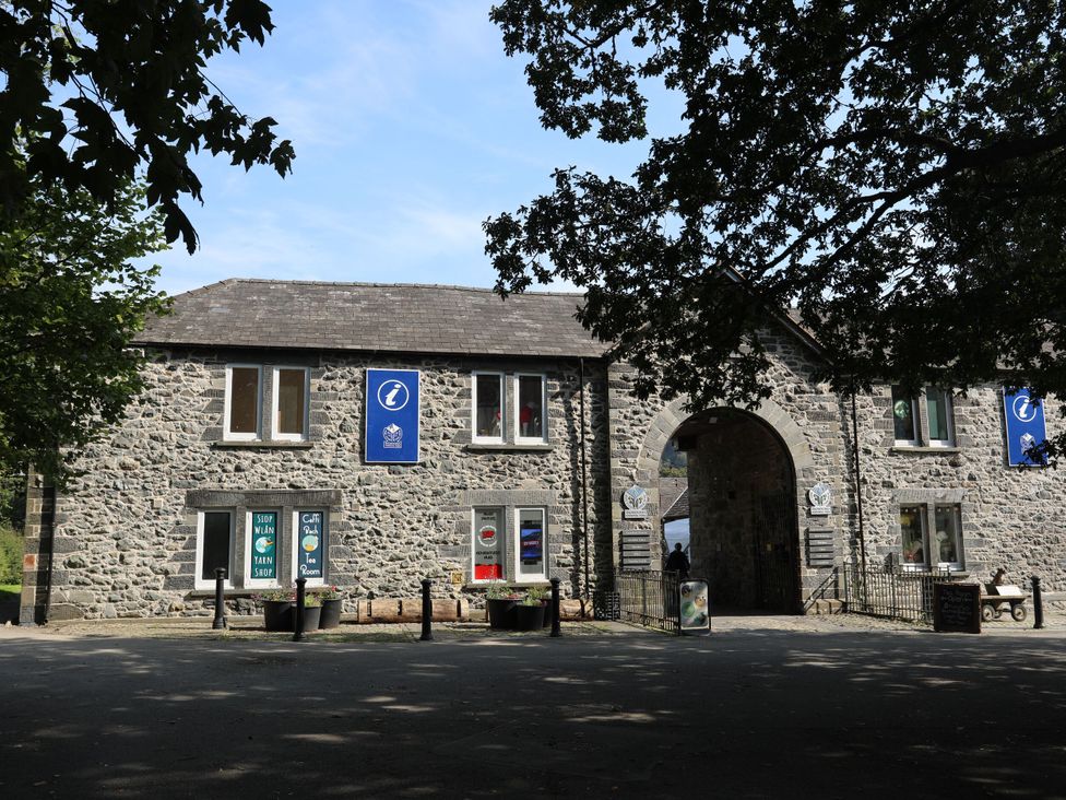 An information center building with signage at Green Bank in Betws-Y-Coed