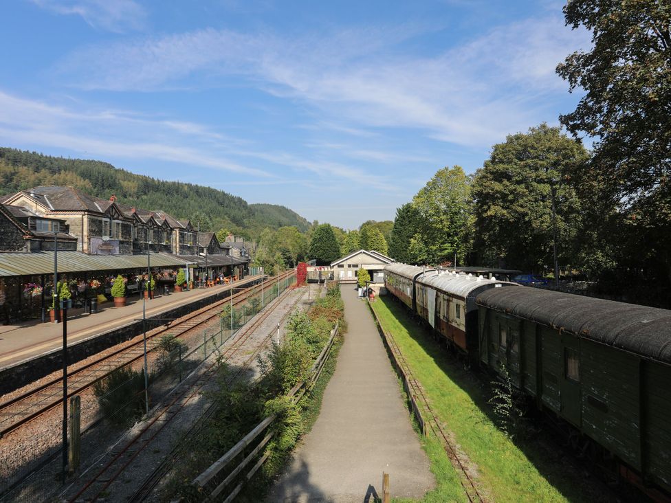 A train station with platforms and railway tracks at Green Bank in Betws-Y-Coed