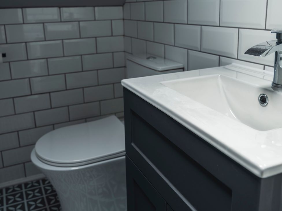 A bathroom with a sink and toilet at Green Bank in Betws-Y-Coed