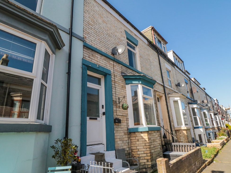 A view of the exterior of a house with windows and a door at Captain Jacks in Whitby