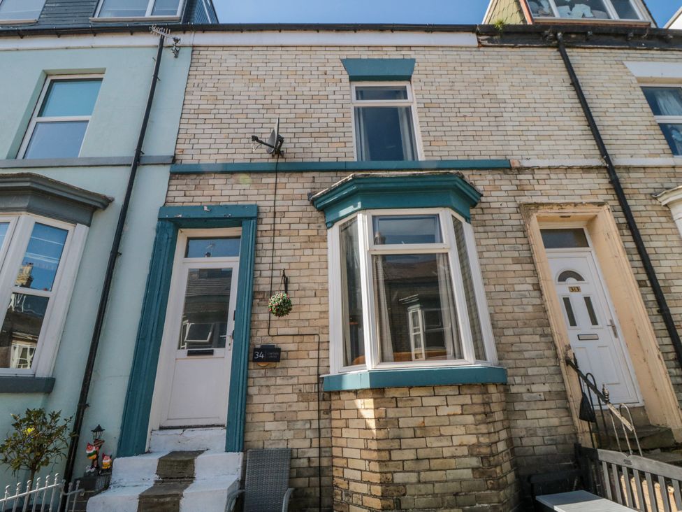 A house front with windows and a door at Captain Jacks in Whitby