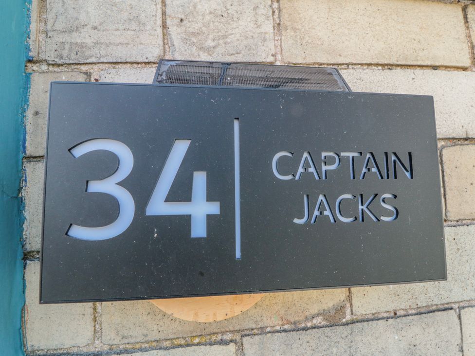 A sign with the number 34 and the name Captain Jacks in Whitby