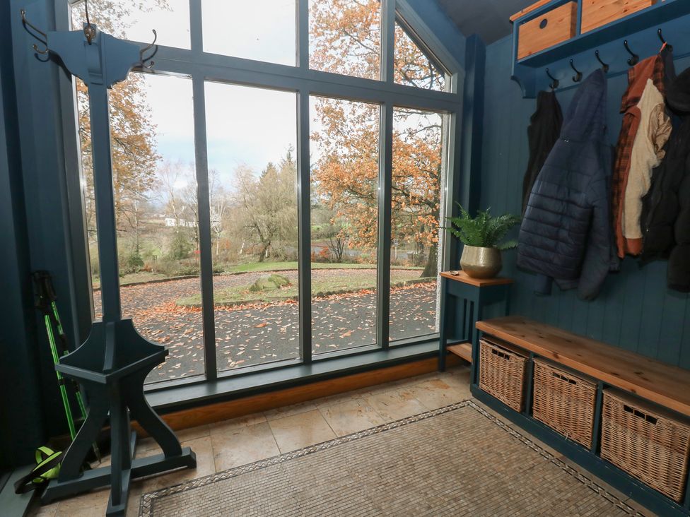 An entryway with coat rack and bench at Chapel Hill in Catlowdy