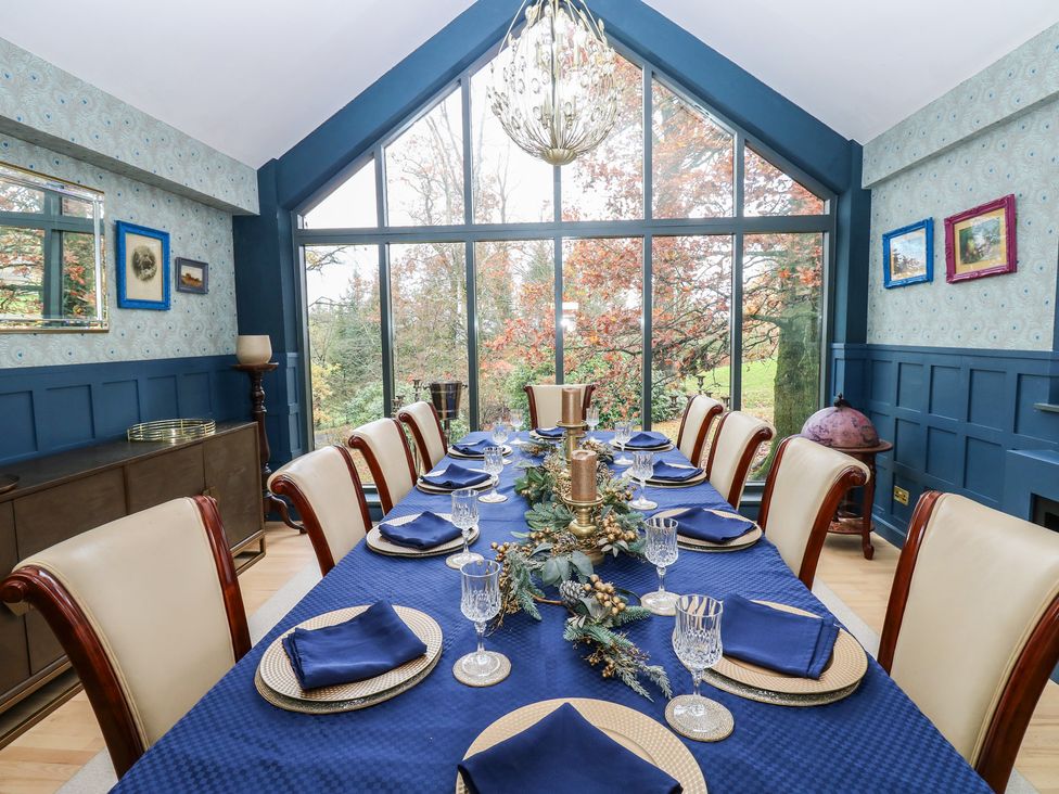 A dining room with a table set for dinner at Chapel Hill in Catlowdy