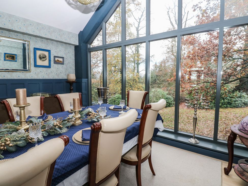 A dining room with a table set for dinner at Chapel Hill, Catlowdy