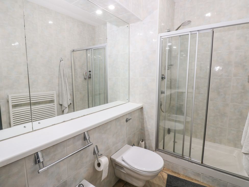 A bathroom with a shower and toilet at Chapel Hill, Catlowdy