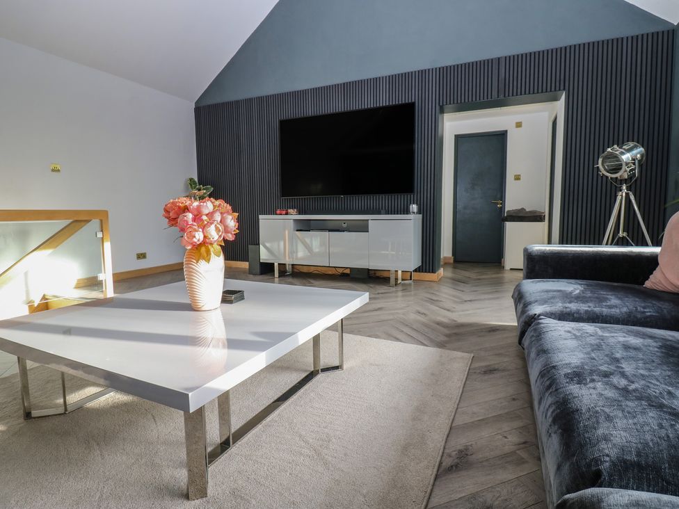 A living room with a coffee table and sofa at Chapel Hill in Catlowdy