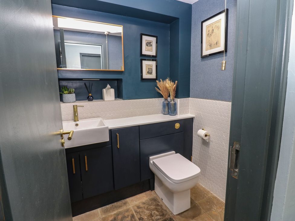A bathroom with a sink and toilet at Chapel Hill in Catlowdy